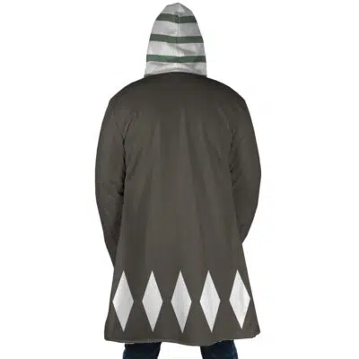 A person is seen from the back wearing the Kisuke Urahara Bleach Dream Cloak Coat, featuring a dark color with white diamond shapes at the bottom and a hood with horizontal white and green stripes.