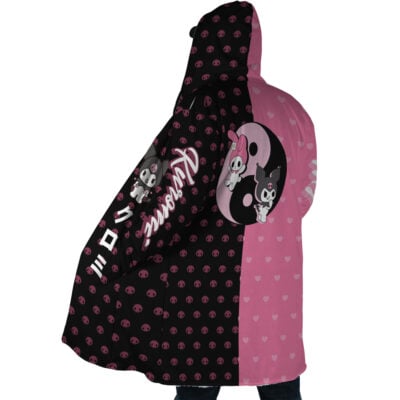 Wearing the My Melody and Kuromi Sanrio Dream Cloak Coat, a person sports a black-and-pink hooded cloak with hearts, skulls, Kuromi and My Melody cartoon characters, and "Kuromi" in large script.