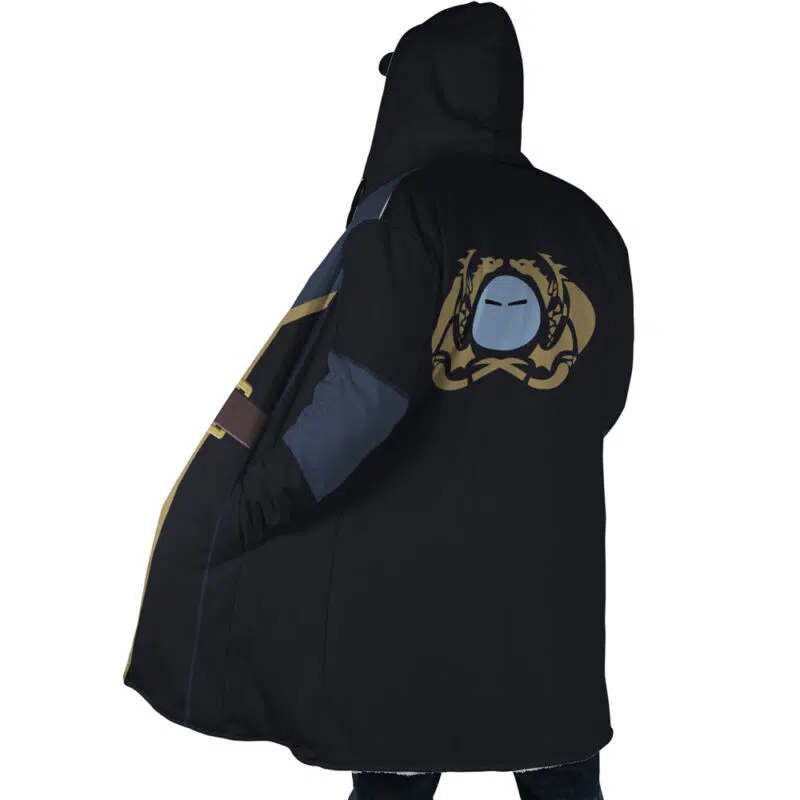 A person stands with their back to the camera, wearing the Rimuru Tempest That Time I Got Reincarnated as a Slime Dream Cloak Coat—black with blue and gold accents, and a large gold and blue masked face emblem on the back.