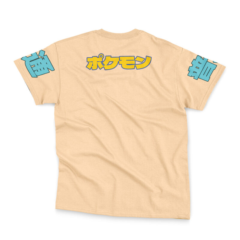 The Snorlax V3 Pokemon Streetwear T-Shirt is beige with bold yellow Japanese katakana text on the upper back and blue stylized Japanese characters on both sleeves, shown flat against a white background.