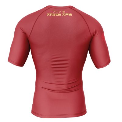 A red Krillin Tacos Dragon Ball Z short sleeve rash guard, seen from the back, shows gold Japanese text and ANIME APE on the upper back plus a subtle red logo on the left sleeve.