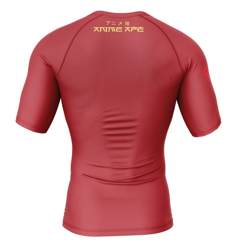 A red Krillin Tacos Dragon Ball Z short sleeve rash guard, seen from the back, shows gold Japanese text and ANIME APE on the upper back plus a subtle red logo on the left sleeve.