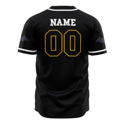 Personalized Batman DC Comics Baseball Jersey in black with white trim features "NAME" in white and a large yellow-outlined number 00 on the back, bat wing graphics on both sleeves, displayed against a plain white background.