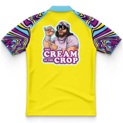 The Cream of the Crop Trippy Randy Savage Polo Shirt is yellow with blue, purple, and pink swirling sleeve patterns. The back shows an illustrated man in sunglasses holding creamer and “THE CREAM OF THE CROP” in bold white and purple letters.