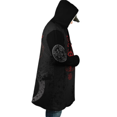 Wearing the Transmutation Circle Fullmetal Alchemist Dream Cloak Coat, a person in jeans and a cap stands in profile against a white background, hands in pockets and head slightly bowed under the hood.