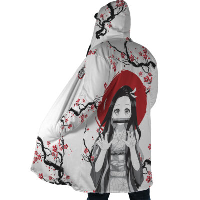 A person wears the Nezuko Kamado Cherry Blossom Demon Slayer Dream Cloak Coat, featuring an anime character with long hair and a bamboo muzzle, set against a red sun and cherry blossoms in black, white, and red tones.