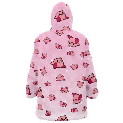The Kirby Pattern Nintendo Snug Oversized Blanket Hoodie features a pink design with cute cartoon Kirbys in different poses and expressions scattered across the fabric, plus more Kirby faces on the hood.