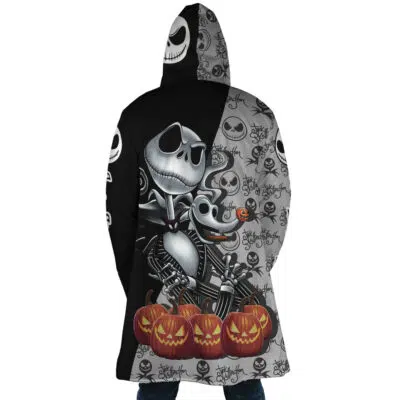 Person wears the Jack Skellington The Nightmare Before Christmas Dream Cloak Coat, a half black, half gray hooded coat with Jack Skellington, Zero the dog, carved pumpkins, and Halloween-themed patterns.