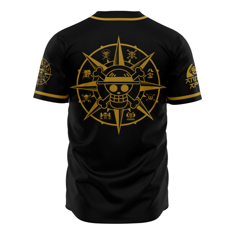 The Straw Hat Grand Fleet One Piece Baseball Jersey is black with gold trim, featuring a large golden compass on the back with a cartoon straw hat skull at the center, surrounded by smaller gold symbols and icons.