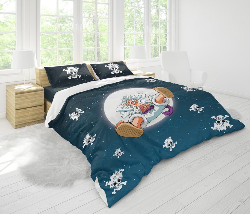 The Gear 5 Luffy v2 One Piece Bedding Set features bold blue bedding with cartoon astronaut goat and star designs, plus small skull accents. The room is bright, with large windows, white walls, and light wood furniture.