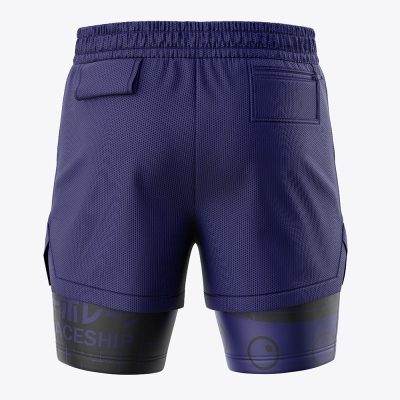 Back view of Capsule Corp DBZ 2-in-1 Performance Shorts in purple with textured fabric, two back pockets, and black graphic designs featuring text and smiley faces near the bottom of the legs.