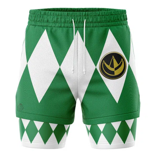The Green Ranger V1 Mighty Morphin Power Rangers 2-in-1 Performance Shorts feature a white diamond pattern, drawstring waistband, and gold circular emblem on the left thigh, with additional green and white diamonds on the lower legs.