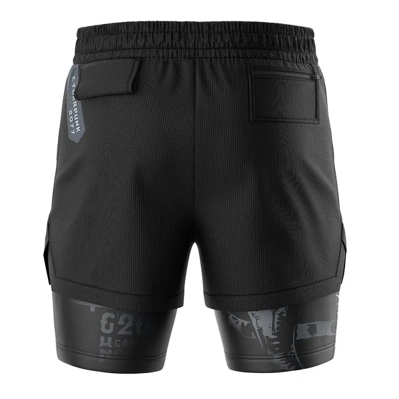 Back view of John Silverhand Cyberpunk 2077 2-in-1 Performance Shorts in black with an elastic waistband, two rear pockets, attached compression shorts with a subtle gray graphic, and a blue tag on the left waistband.