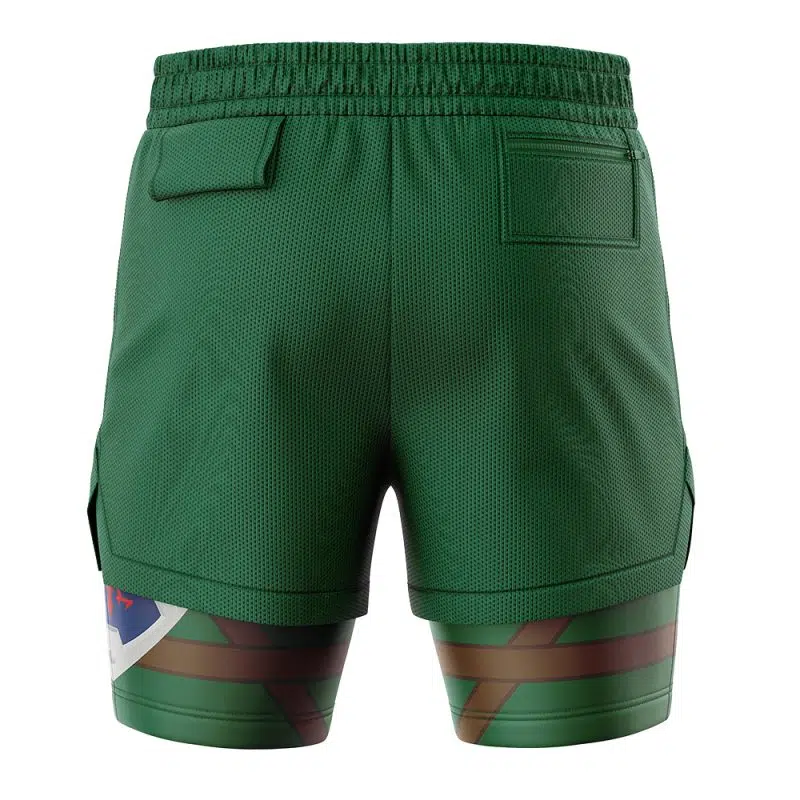 The Link Legend of Zelda 2-in-1 Performance Shorts are green athletic shorts with an elastic waistband, back pockets, and built-in compression shorts featuring a multicolor camouflage pattern on the lower thighs.