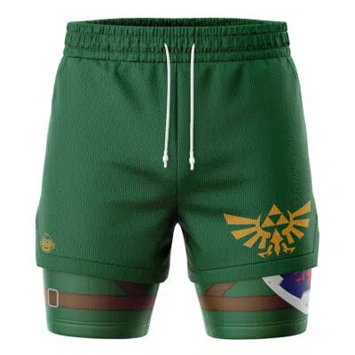 The Link Legend of Zelda 2-in-1 Performance Shorts are green with a drawstring waist and feature a yellow Triforce and Hylian crest on one leg plus shield and belt graphics, inspired by The Legend of Zelda.