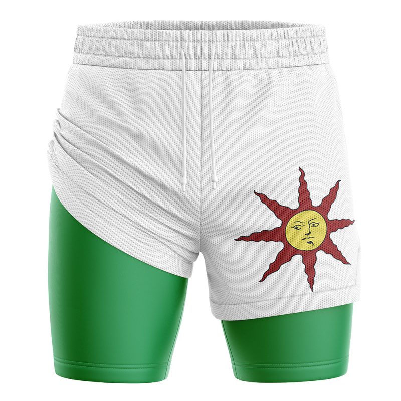The Praise the Sun Dark Souls Performance Shorts are white athletic shorts with a green inner compression layer, featuring a stylized yellow sun with a face and brown rays printed on the right thigh, plus a white drawstring at the waistband.