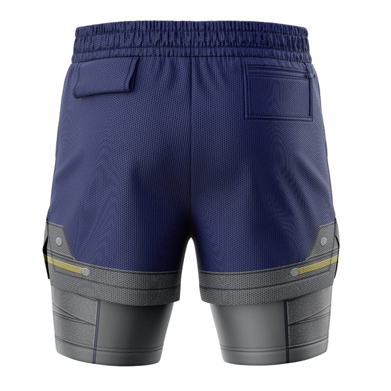The Shield Style Legend of Zelda 2-in-1 Performance Shorts are shown from the back, featuring a navy textured upper section, two back pockets, and a gray metallic-patterned lower with yellow side accents.