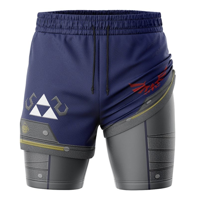 The Shield Style Legend of Zelda 2-in-1 Performance Shorts feature a blue waistband, Triforce symbol, red winged crest, and detailed gray panels that mimic armor plating, inspired by iconic gaming aesthetics.