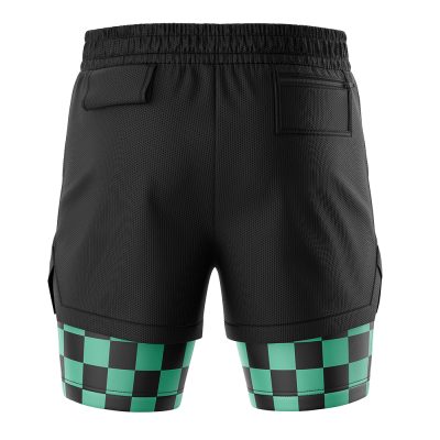 The Tanjiro Kamado Demon Slayer Performance Shorts are black athletic shorts with an elastic waistband, two back pockets, and green-and-black checkerboard patterns on the lower legs. The fabric appears breathable.