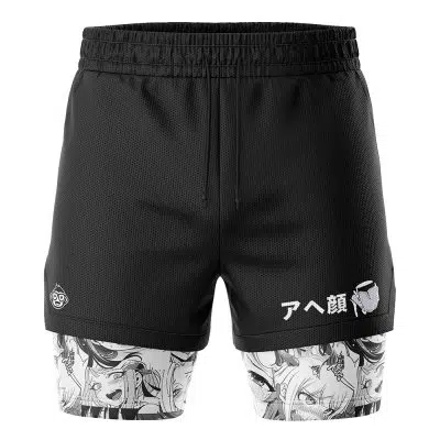 The Ahegao Manga 2-in-1 Performance Shorts are black athletic shorts with a drawstring waist, featuring manga-style expressive faces on the inner lining and Japanese text with a small character graphic on one leg.