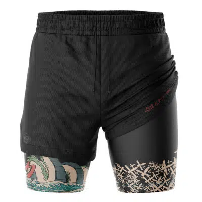 The Haku Spirited Away 2-in-1 Performance Shorts feature a layered black design with a mesh outer layer over inner leggings, showcasing a dragon illustration on one leg and a beige abstract pattern on the other.