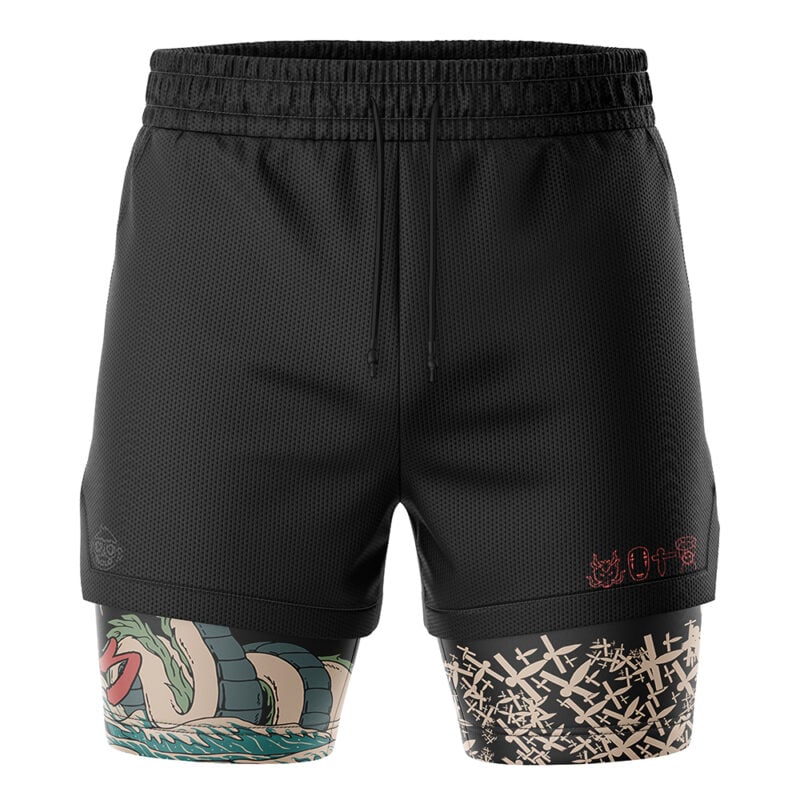 The Haku Spirited Away 2-in-1 Performance Shorts feature black athletic outer shorts with an elastic waistband and attached inner compression shorts. The left inner leg has a dragon tattoo, the right has a beige abstract pattern, plus red and gray symbols near the hem.