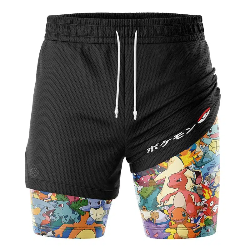 The Pocket Monsters Pokemon 2-in-1 Performance Shorts feature black athletic fabric with a white drawstring; the left leg is plain black, and the right showcases colorful Pokémon characters, Japanese text, and a Poké Ball graphic.