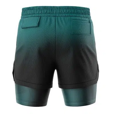 Back view of the Snorlax Pokemon 2-in-1 Performance Shorts for men in dark teal and black, featuring an elastic waistband, mesh texture, two rear pockets, and built-in compression shorts.