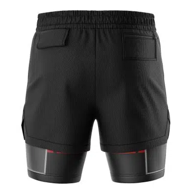 Back view of Sora Kingdom Hearts 2-in-1 Performance Shorts in black, with an elastic waistband, two back pockets, and attached black compression shorts featuring red and gray accents at the hems.