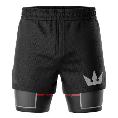 The Sora Kingdom Hearts 2-in-1 Performance Shorts feature black athletic layers: a mesh outer with a white crown graphic on the right leg, and an inner layer with black, gray, and red accents, all held by an elastic waistband.