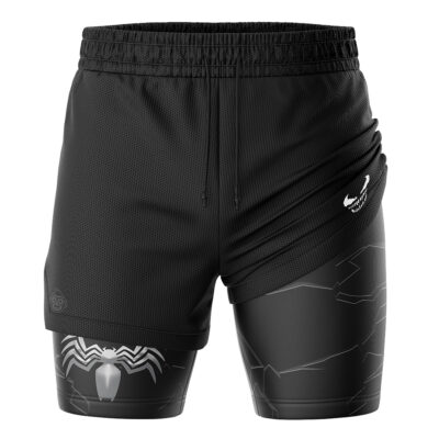 The Venom Marvel Comics 2-in-1 Performance Shorts feature black athletic styling with an outer mesh layer, inner compression layer, a white spider emblem, subtle cracked patterns, and a small white logo on the right side.