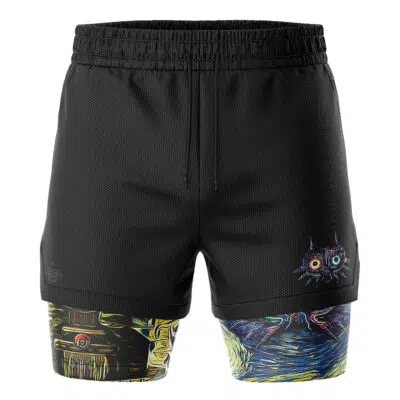 The Zelda Majora's Mask Starry Night 2-in-1 Performance Shorts feature black outer shorts with a drawstring waistband and a colorful abstract cat face on the left leg, revealing multicolored geometric patterned compression shorts underneath.
