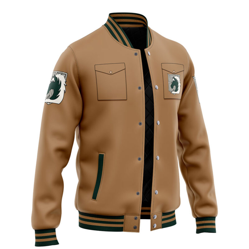 The Garrison Attack on Titan Varsity Jacket features tan fabric, green and black striped cuffs and collar, two front pockets, and wolf head patches on the chest and upper sleeve. Displayed against a white background.