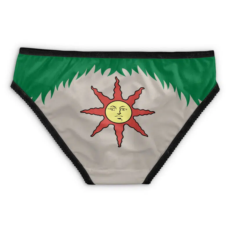 Johnny Silverhand Cyberpunk 2077 Panties: Bikini-style underwear with a green waistband, beige background, and a red and yellow sun face design at the center. Black-edged for contrast.