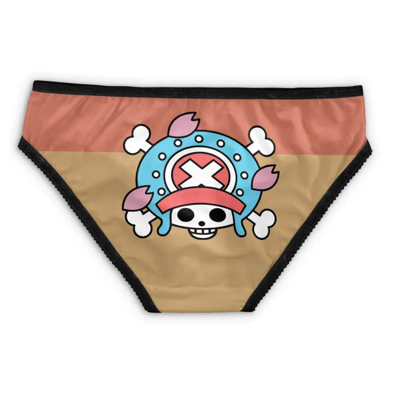 Luffy Egghead One Piece Panties: Bikini-style underwear with a cartoon skull wearing a blue helmet, red X, antlers, and crossbones on a tan and brown background, finished with black trim.