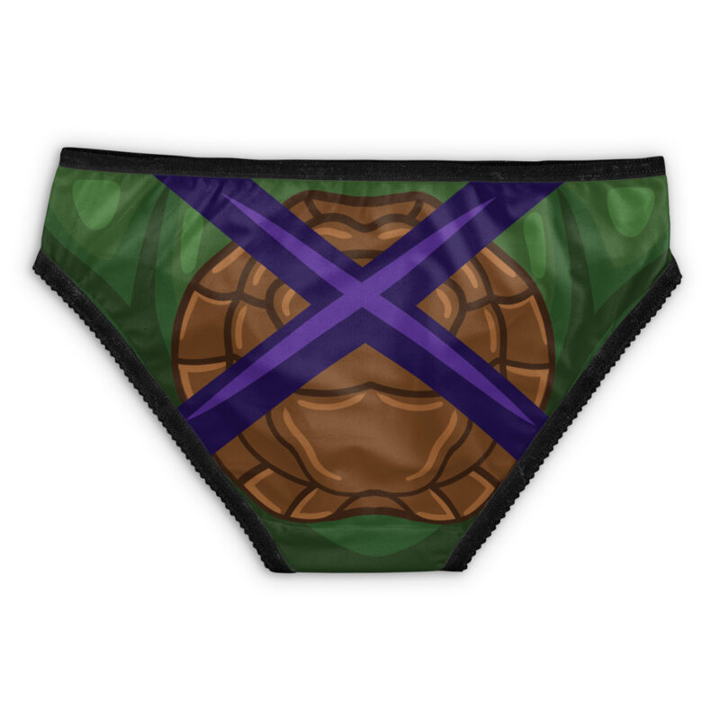 Leonardo Teenage Mutant Ninja Turtles Panties featuring green fabric, a brown turtle shell design on the front, and a purple X accented with black trim.