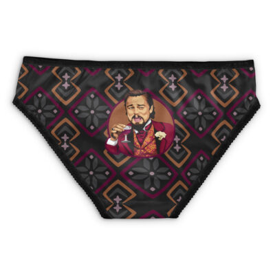 Black underwear with a geometric diamond pattern in brown, pink, and gray, featuring Skeletor from Masters of the Universe in the center, depicted smiling in a red suit holding a drink with a raised eyebrow.