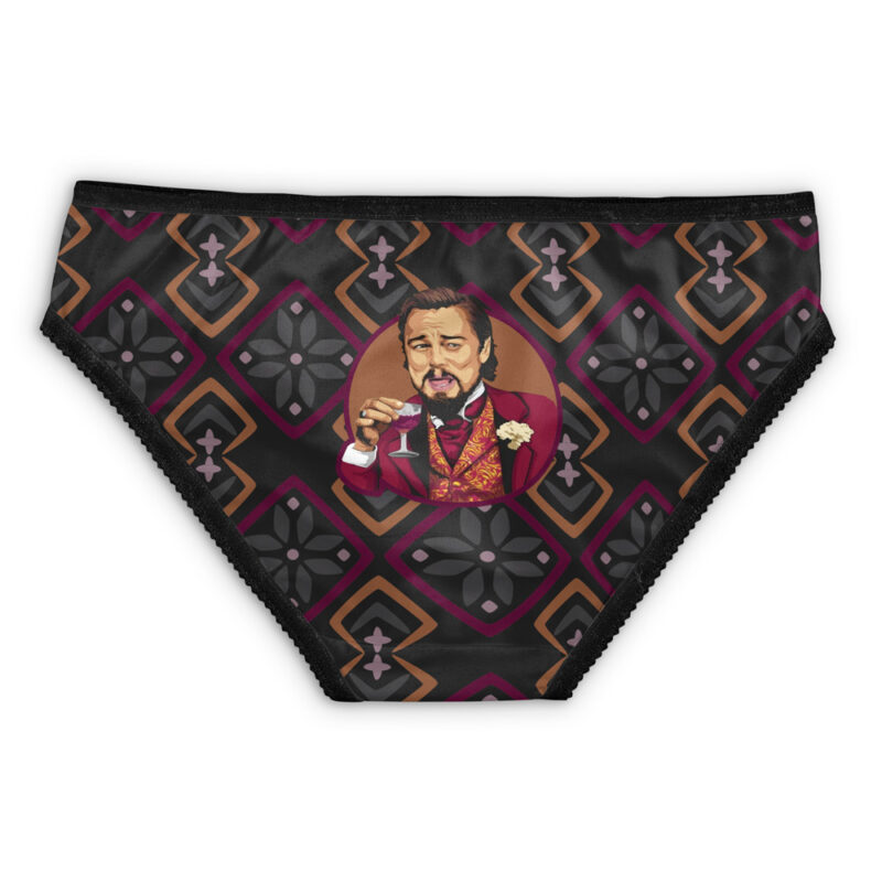 Black underwear with a geometric diamond pattern in brown, pink, and gray, featuring Skeletor from Masters of the Universe in the center, depicted smiling in a red suit holding a drink with a raised eyebrow.