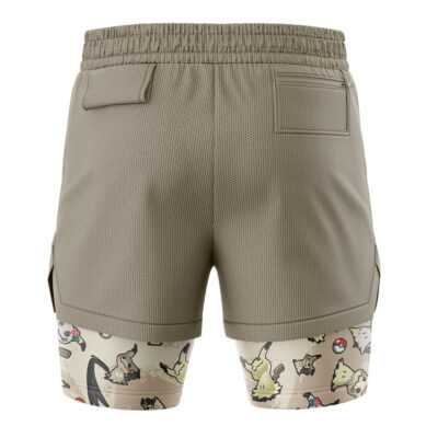 The Umbreon Trippy Pokemon 2-in-1 Performance Shorts are khaki athletic shorts with a mesh texture, pockets, and an elastic waistband. The inner layer features cartoon animals and Poké Balls in soft colors.