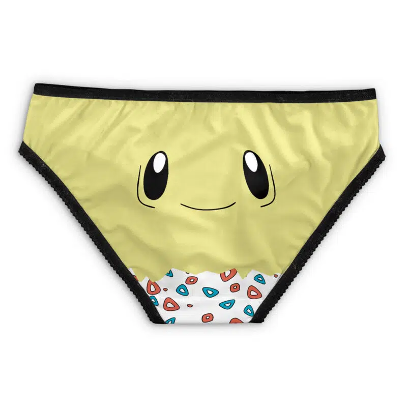 Totodile Face Pokemon Panties: Yellow bikini-style underwear with black trim, a cute Totodile cartoon face, and red, blue, and white geometric shapes at the bottom center.