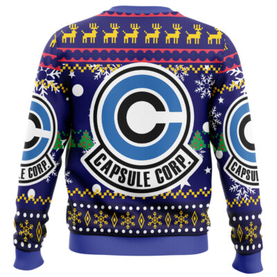 The Piccolo Dragon Ball Z Ugly Christmas Sweater features a blue background with the Capsule Corp. logo, yellow reindeer, trees, and snowflakes in a vibrant holiday-themed design.