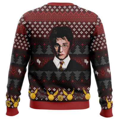 A festive sweater featuring an illustrated Harry Potter portrait in glasses and tie, holiday patterns, trees, Golden Snitches, and HP initials on a red, black, and white background. Product: Christmas Slytherin Harry Potter Ugly Christmas Sweater.