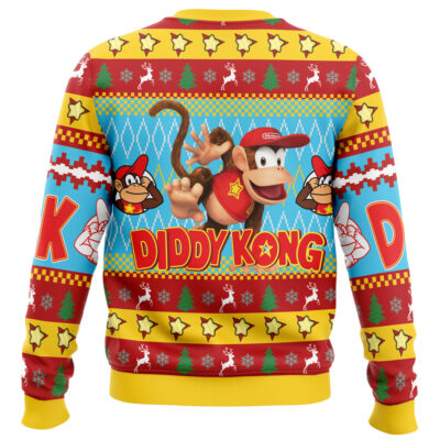 A festive Christmas sweater featuring Curious George in the center, surrounded by holiday patterns. The sweater is mainly red, yellow, and blue with CURIOUS GEORGE written in bold letters.