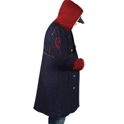 A person stands in profile wearing the Zed Kiba Dream Cloak Coat: a long, dark blue coat with silver buttons, red hood, red gloves, a red emblem on the upper sleeve, and paired with blue jeans.
