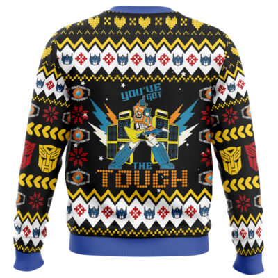 Festive Christmas Courage The Cowardly Dog Ugly Christmas Sweater featuring pixel-style robot DJ, speakers, snowflakes, bold shapes, and blue robot faces. Includes “You’ve got the tough” text and a blue, yellow, red, black & white color pattern.