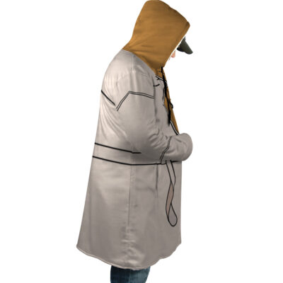 A person in profile with hands in pockets wears the Mikey Sano Manjiro Flannel Tokyo Revengers Dream Cloak Coat—long, light gray with black lines and a brown hood—plus blue jeans and a cap. The background is white.