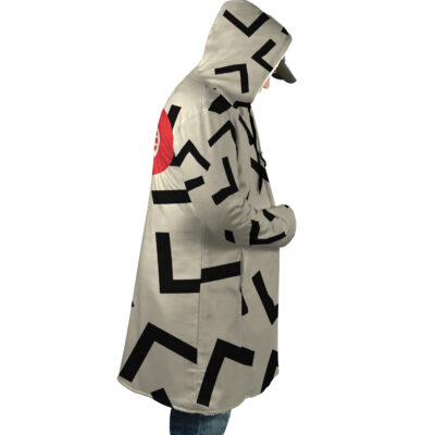 A person stands in profile with hands in pockets, wearing the Snow Cat Cosplay GI Joe Dream Cloak Coat—a hooded beige coat featuring bold black zigzag patterns and a red circle on the back.
