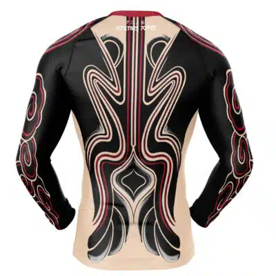 The Enjin's Body Tattoos Gachiakuta Long Sleeve Rash Guard Compression Shirt features bold, symmetrical tribal-inspired patterns in black, red, and beige with curved lines and shapes down the sleeves and back, shown from the rear.
