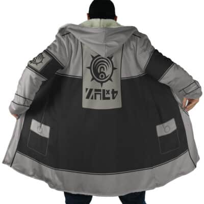 A person models the Sidon The Legend of Zelda Dream Cloak Coat, featuring a gray and black hood with a large futuristic emblem and symbols on the back, holding it open to showcase the design; face not shown.