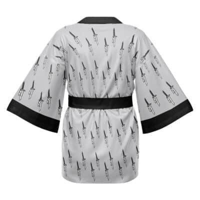 The Sukuna Jujutsu Kaisen Happi Coat Haori Kimono features a light gray, kimono-style design with black trim on the collar, sleeves, and belt, plus a repeating black dagger pattern. The image shows the back of the robe.